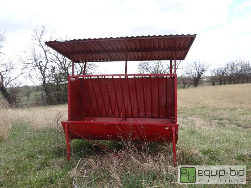 lot 2240 image: Cattle hay feeder with metal roof....