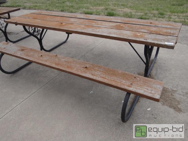 lot 2242 image: Wood with metal frame picnic table.  8 feet l...