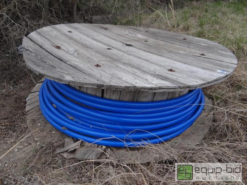 lot 2259 image: Partial spool of thick blue tubing....
