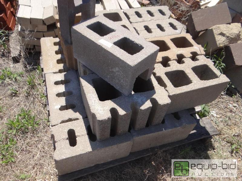 lot 2779 image: 3 Pallet of building block.  Skid loader an...