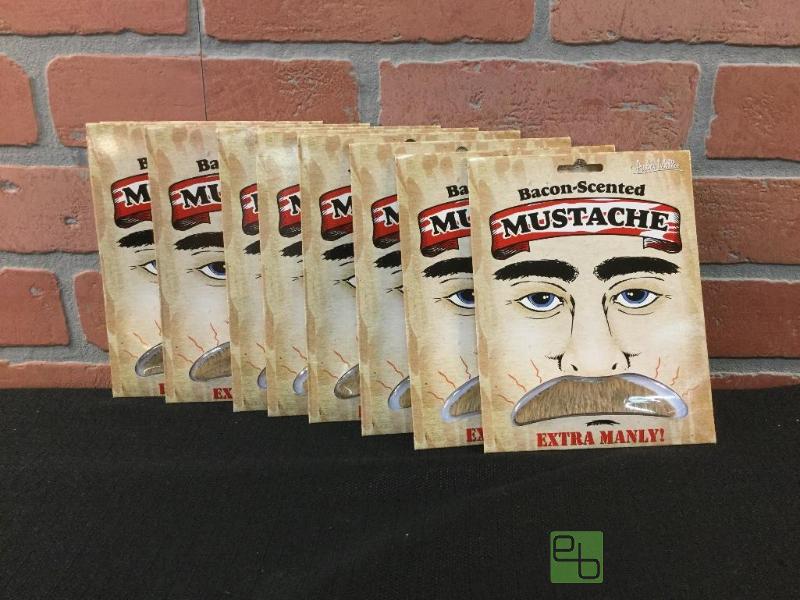 lot 105 image: Bacon-Scented Mustache  Quantity 10 Item# 1...
