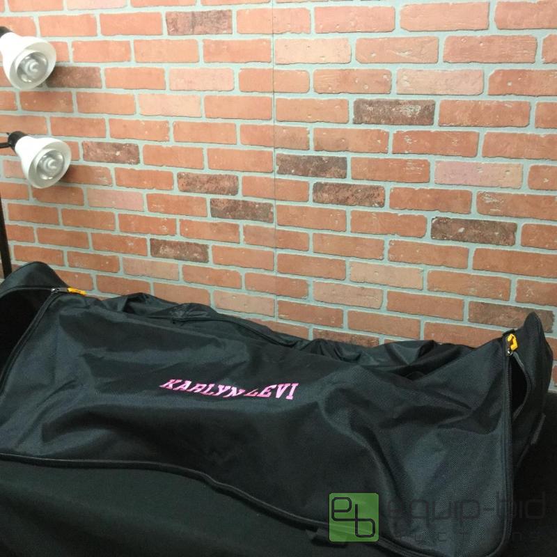 lot 12 image: Biltmore 52&quot 1800 Denier Black Soft Trun...