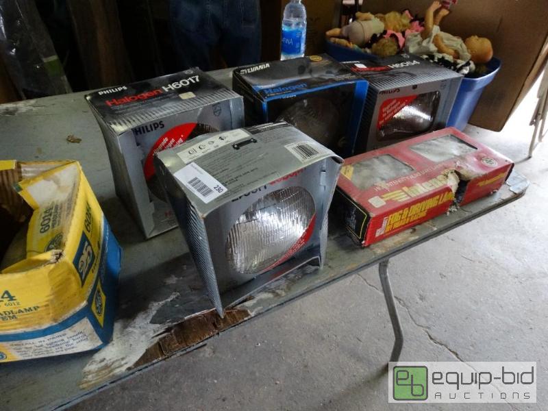lot 230 image: Lot of various unused headlights....