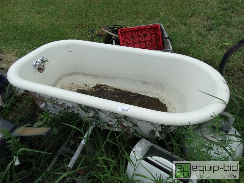 lot 275 image: Cast iron bath tub with claw feet....