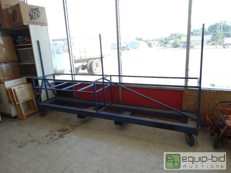 lot 1557 image: Big blue cart on wheels.  This has forklift h...