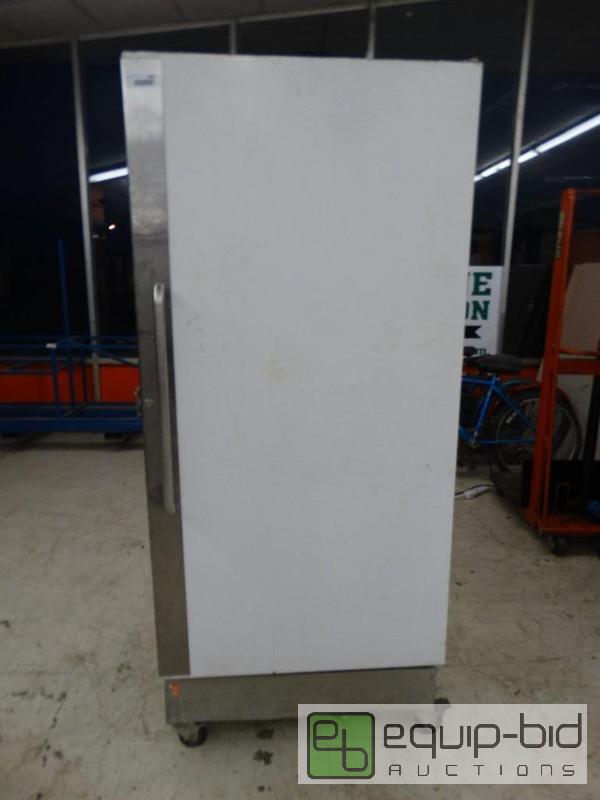 lot 1558 image: Commercial upright freezer on wheels.  Runs ...