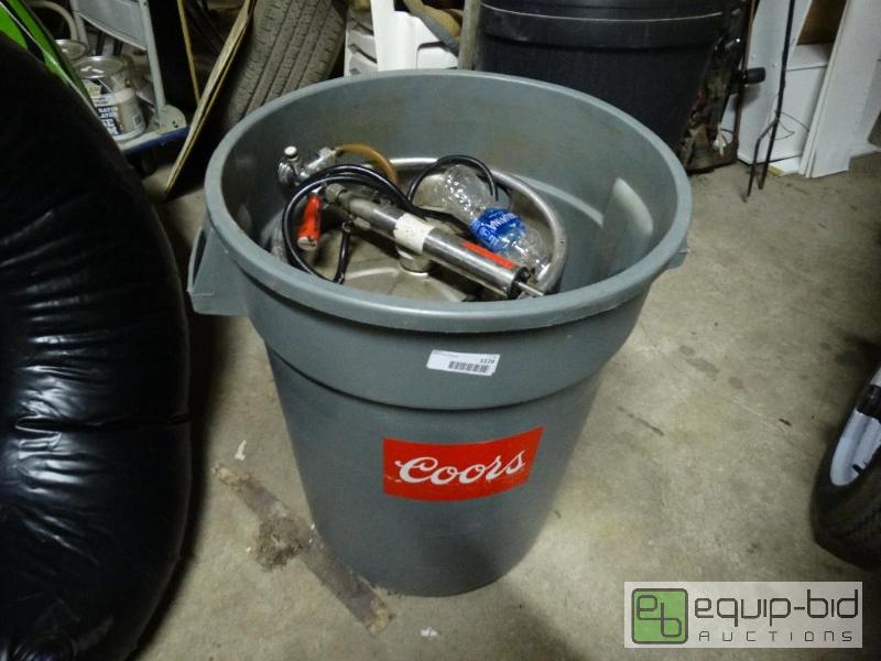 lot 1129 image: Keg with pump in the trash can....