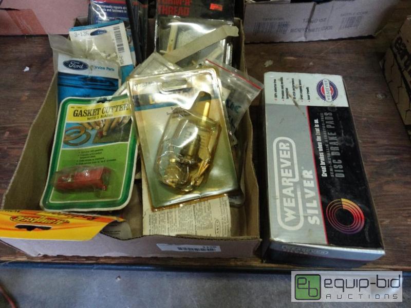 lot 1158 image: Brake pads and car parts in box....