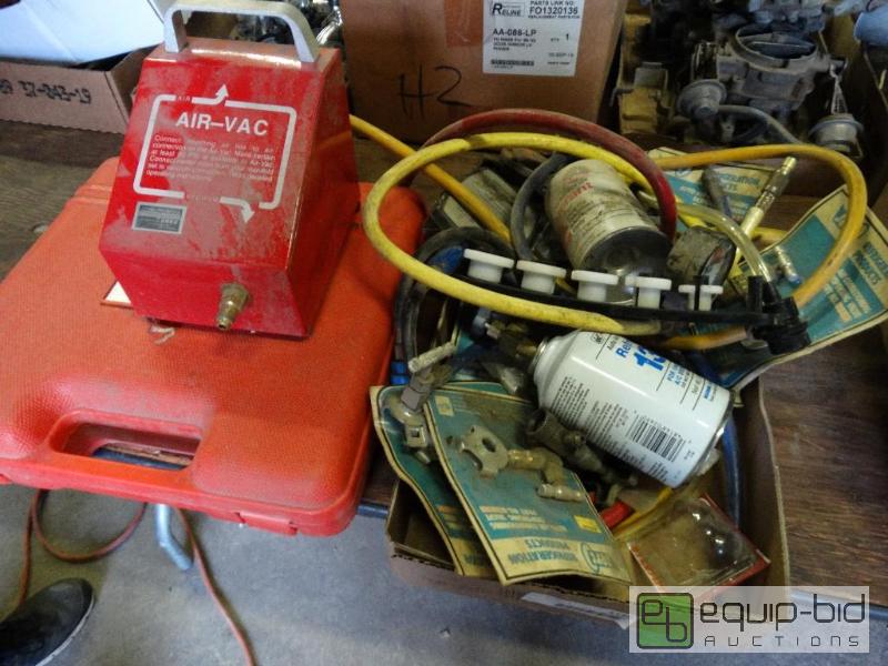 lot 1159 image: Car AC parts and hoses. Gauge case....