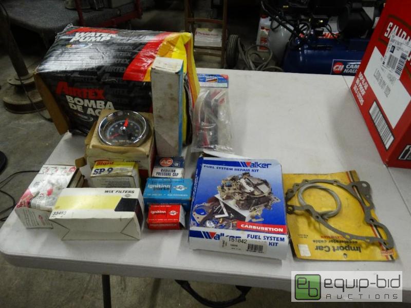 lot 1212 image: Water pump and new car parts....