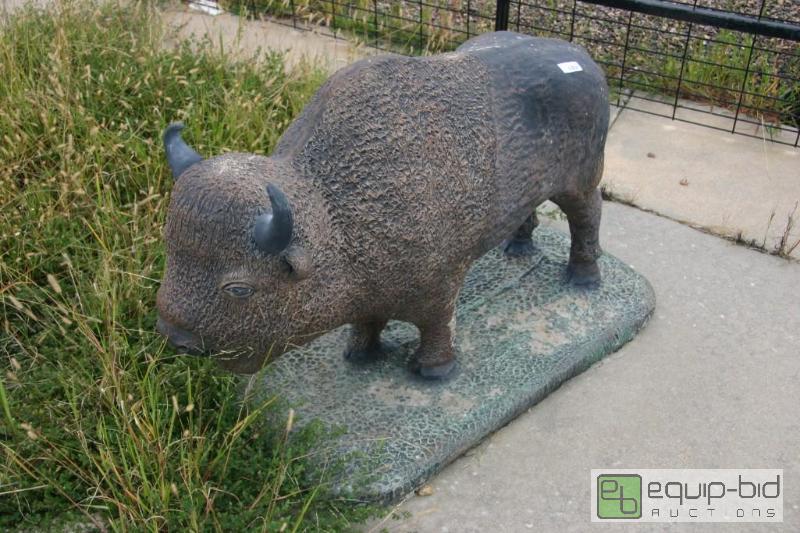 lot 103 image: Cement buffalo statue....