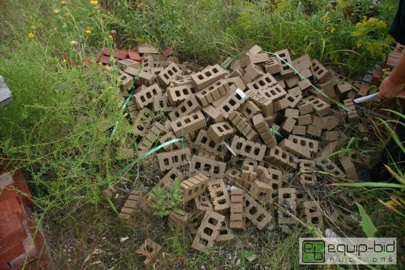 lot 158 image: pile of 3 hole bricks - beige...