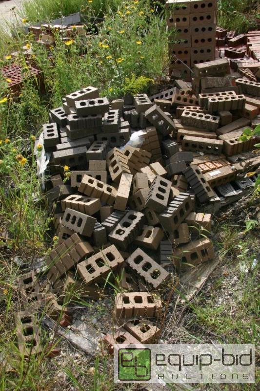 lot 205 image: large pile of earth tone 3 hole bricks...