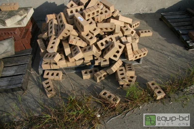 lot 216 image: pallet of beige 3 hole brick...