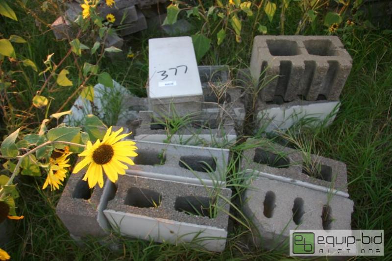 lot 377 image: 2 stacks of enamel faced cinder blocks...