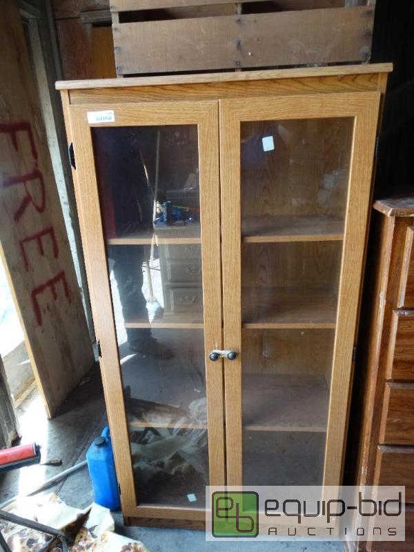 lot 1228 image: Wood bookshelf with glass doors....