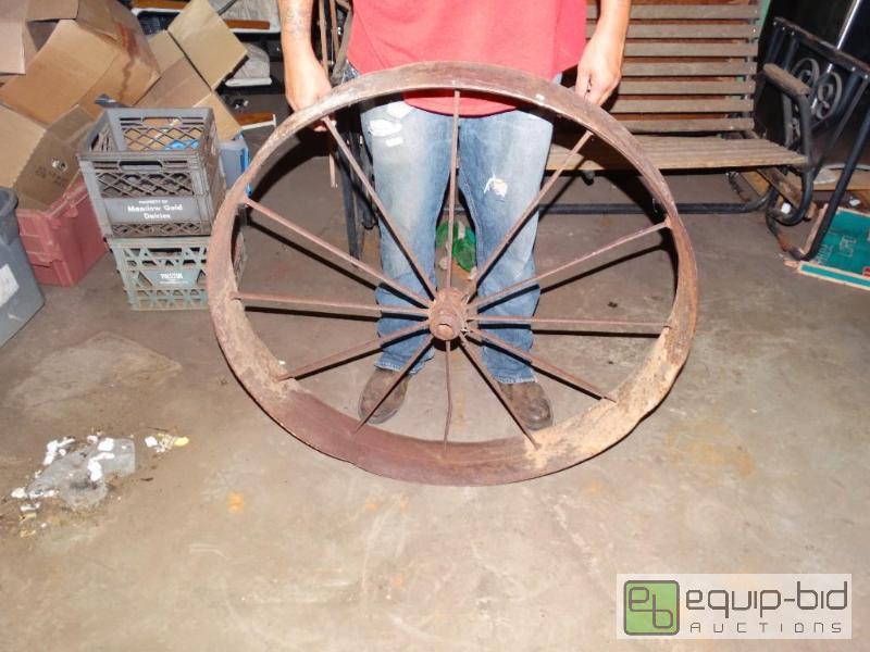 lot 1287 image: Metal wagon wheel....