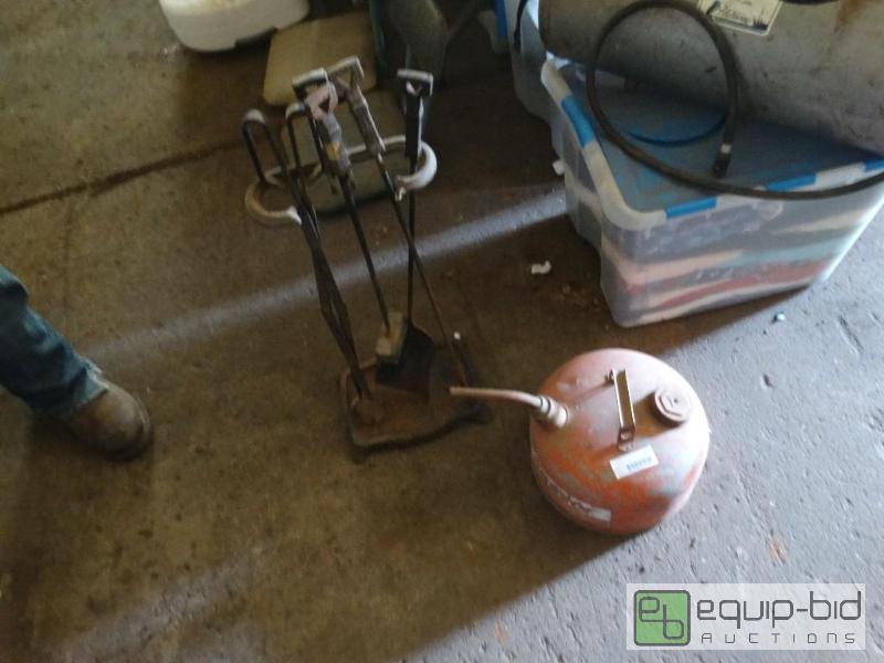lot 1295 image: Fire place tools and a gas can....