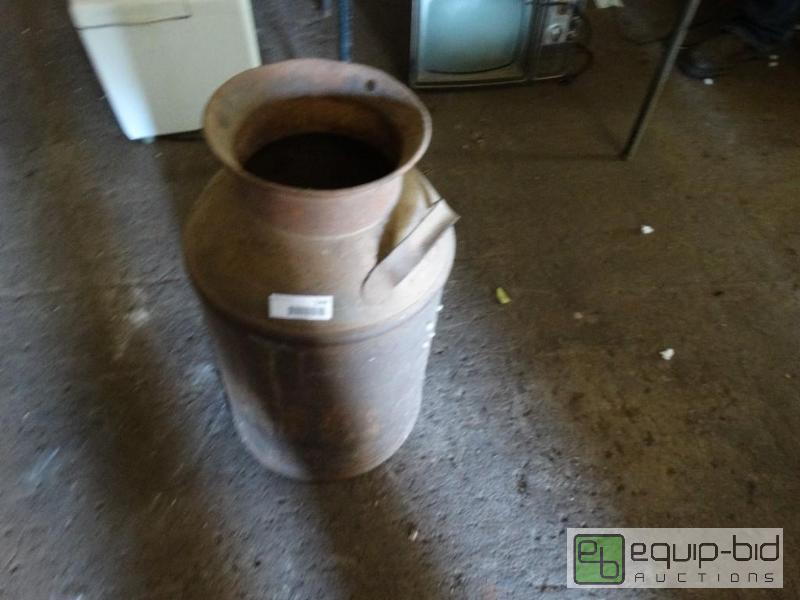 lot 1296 image: Old milk can....