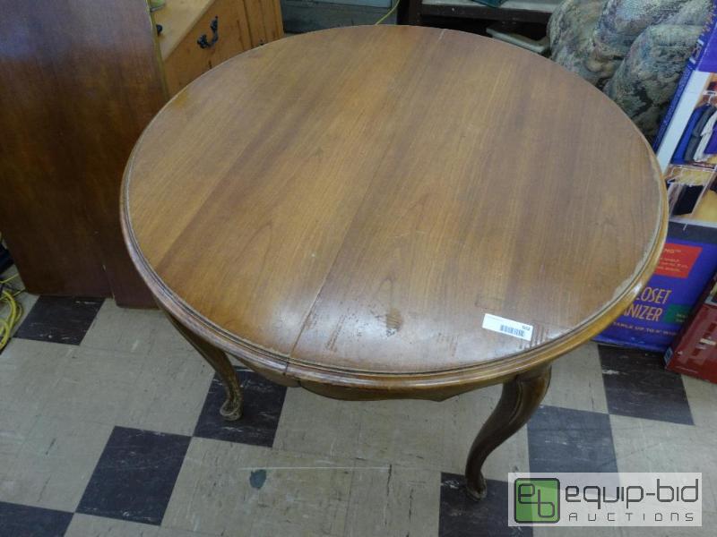 lot 502 image: Round wood dining table with 2 leaves....