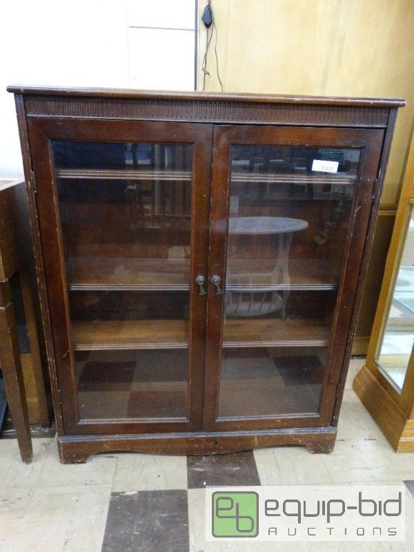 lot 521 image: Antique wood cabinet with glass doors....
