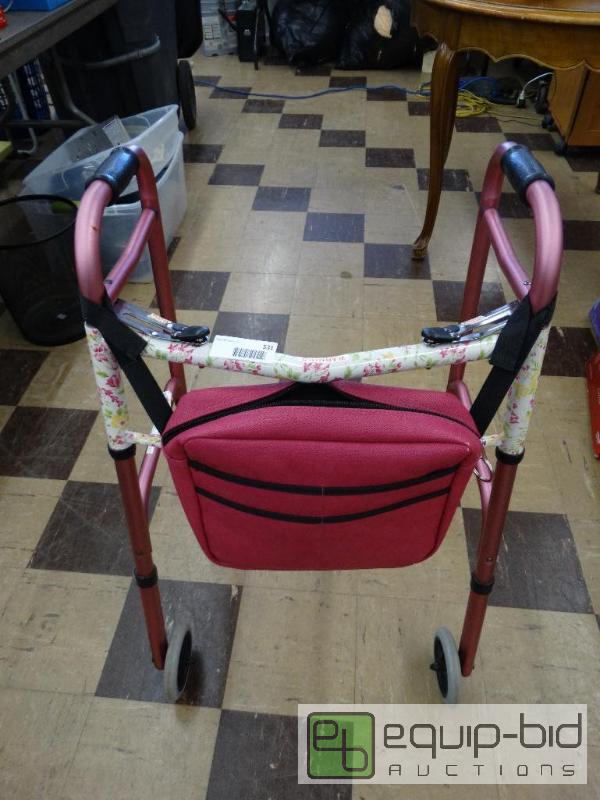 lot 531 image: Nova pink metal folding walker with zipper pa...