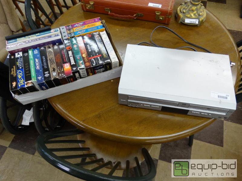 lot 552 image: Panasonic VHSDVD player and box of movies....