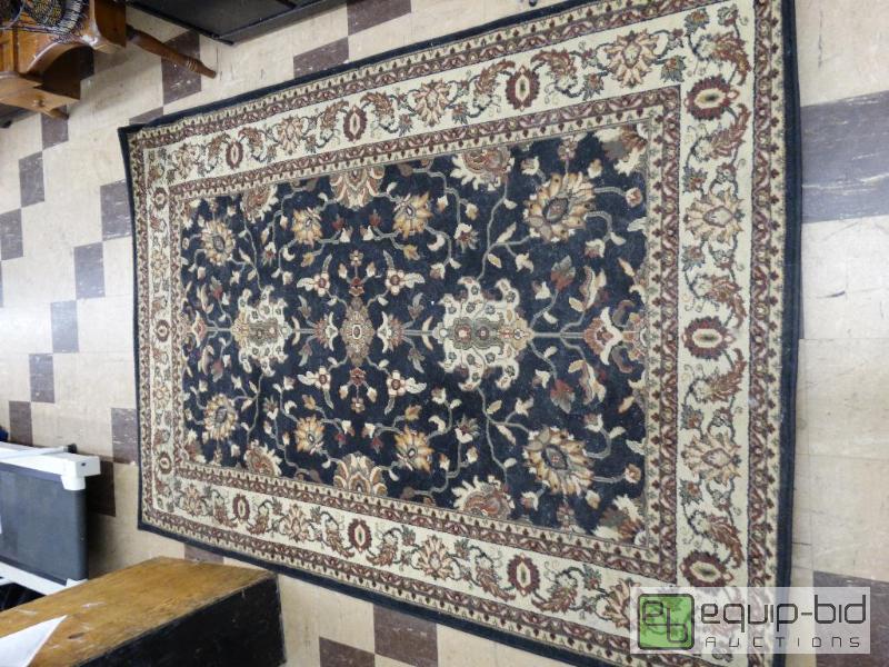 lot 571 image: 5 x 8 area rug.  Black with floral design....