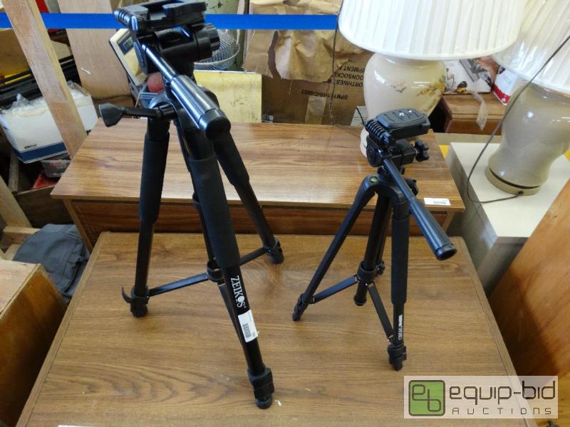 lot 620 image: 2 camera tri-pods.  Large one is Zeikos brand...