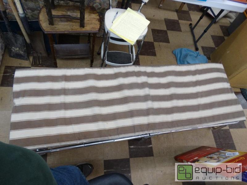 lot 630 image: Coleman fold up cot with foam mattress....