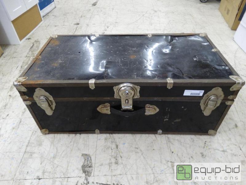 lot 652 image: Black metal foot locker....