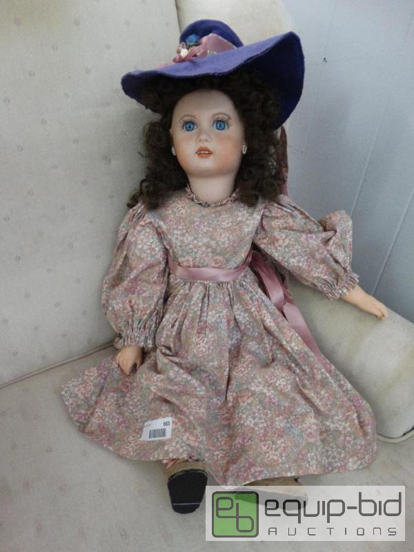lot 663 image: Large porcelain doll with custom clothes and ...