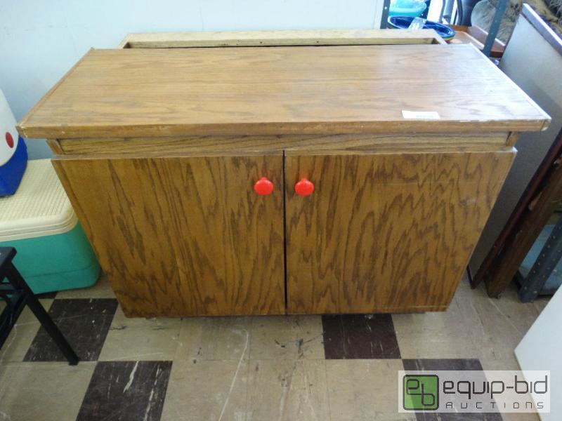 lot 670 image: Oak cabinet with under storage....