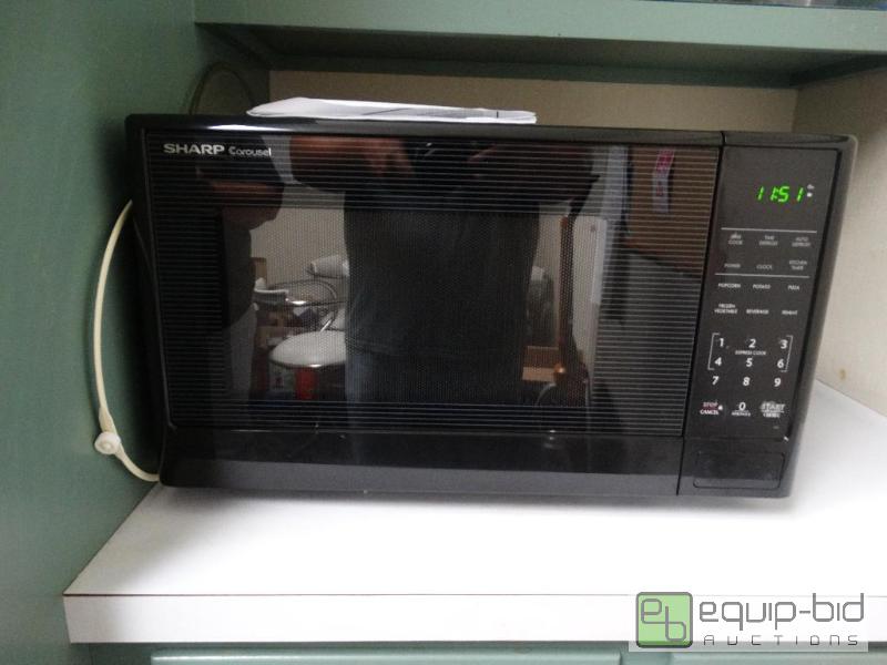 lot 703 image: Sharp Carousel Microwave 1000 Watts With Manu...
