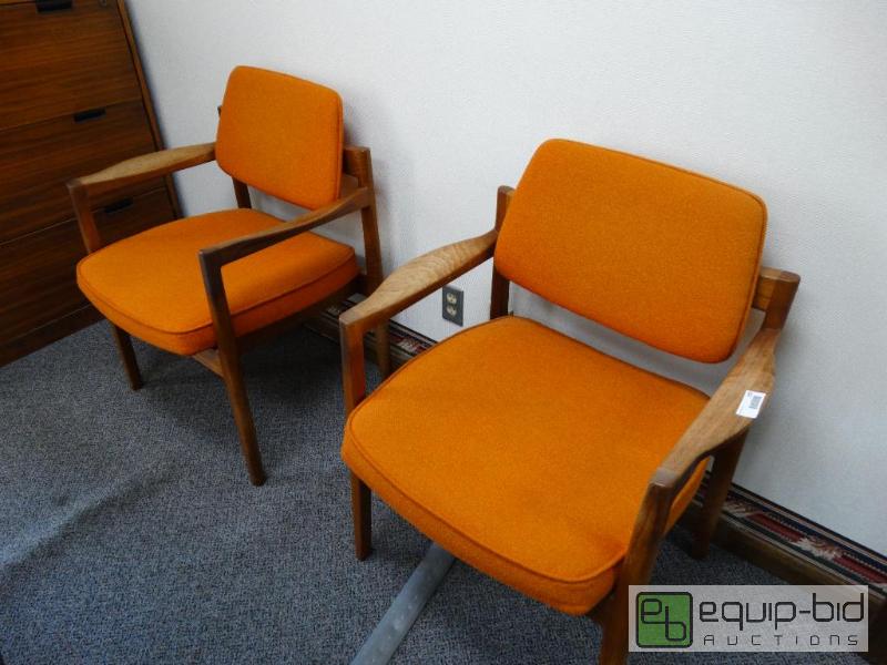 lot 810 image: 2 office Chairs Orange &amp Wooden Legs....