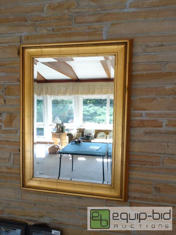 lot 2227 image: Large beveled edge wall mirror in gold frame....