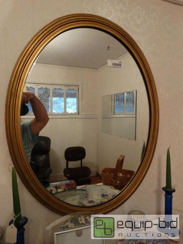 lot 2293 image: Oval mirror with gold frame....