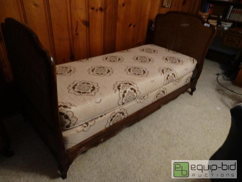 lot 2313 image: Vintage wood daybed with wicker ends.  Includ...